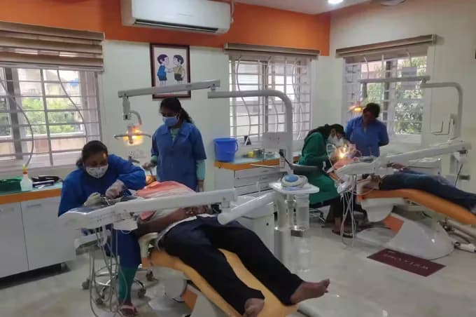 Clinical specialists collaborating chairside at Krishna Sai Dental