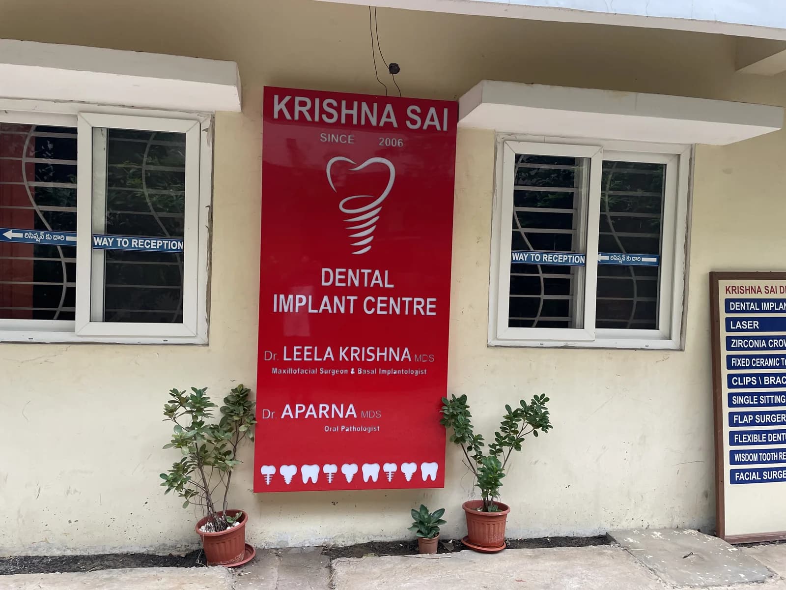Roadside pillar signage and entrance board for Krishna Sai EHS Dental Prasadampadu